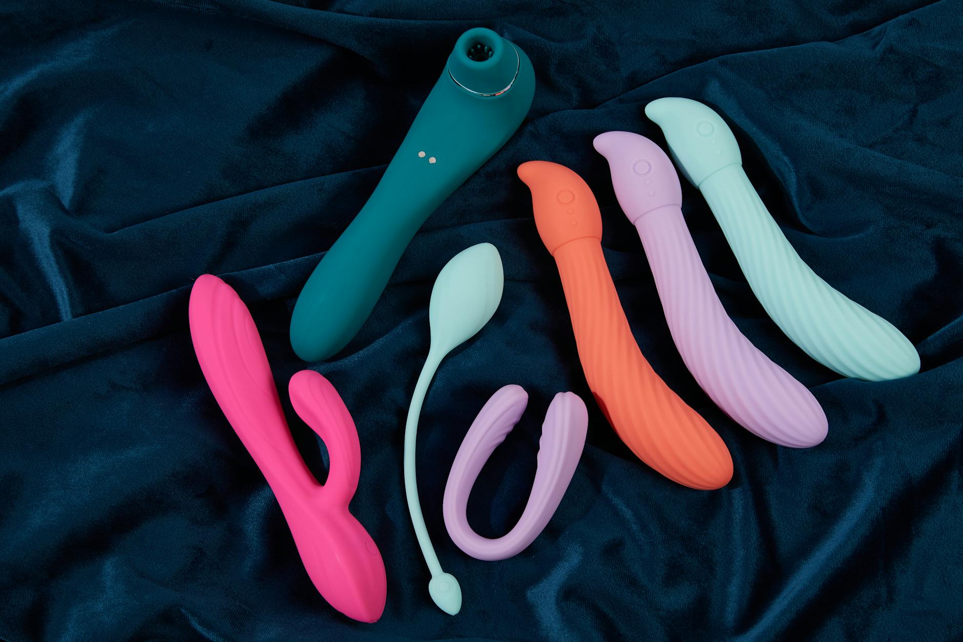 A couple holding a vibrator together, representing modern intimacy and partnership