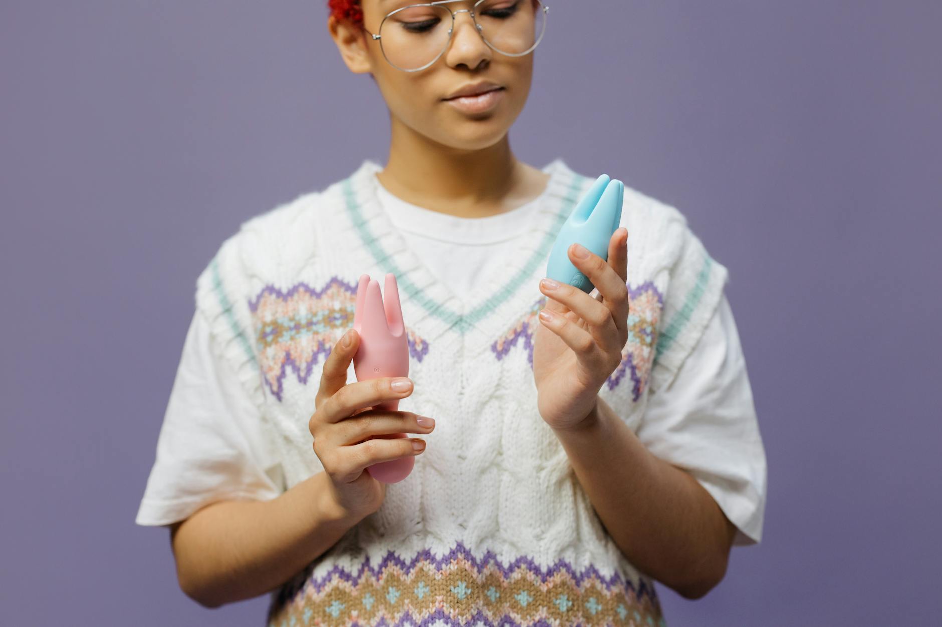 Woman holding lemon vibrators contemplating her pleasure journey with pelvic floor awareness
