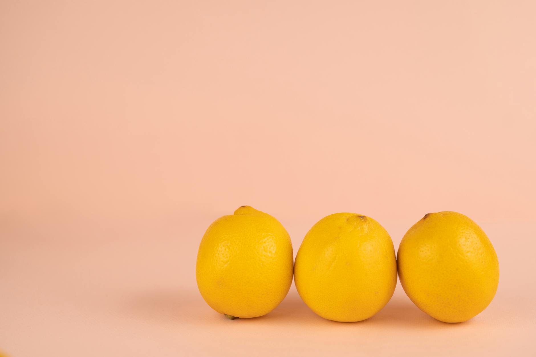 Woman holding a fresh lemon, representing communication and freshness in intimate relationships